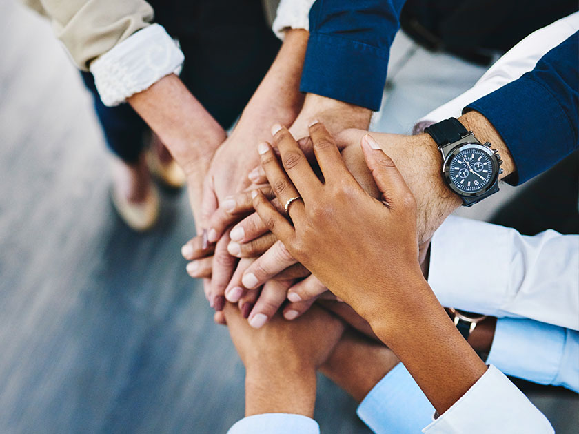 Hands stacked together